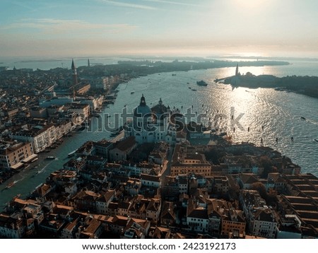 Aerial picture of Venice with famous landmarks San Marco square and Church of Santa Maria during morning golden hour