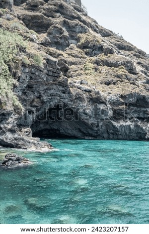 blue sea coast cave rocks