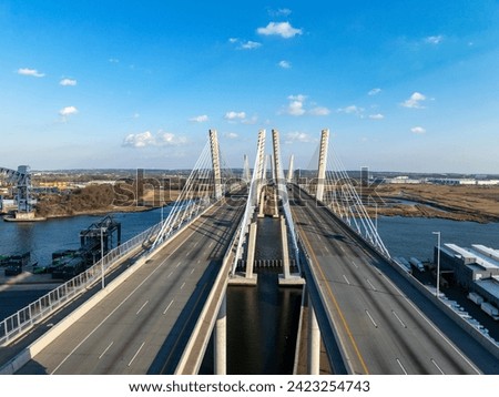 Aerial view of the New Goethals Bridge, spanning Arthur Kill strait between Elizabeth, New Jersey and Staten Island, New York on a sunny afternoon. The New Goethals Bridge carries 6 lanes of I-278. Royalty-Free Stock Photo #2423254743