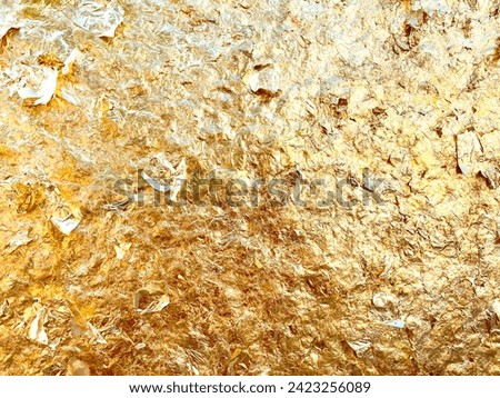 Texture of the gold leaf, Gold background, Picture from Buddha image Back.