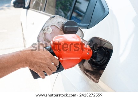 Refuel the car at the refueling point. Energy Concepts Gasoline Gasohol Alternative Energy Royalty-Free Stock Photo #2423272559