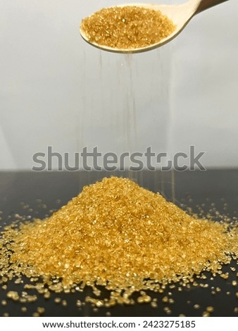 This is a picture of a pile of sugar. It has a sweet taste.