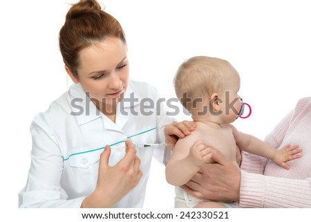 Doctors hand with syringe vaccinating child baby flu injection shot isolated on a white background