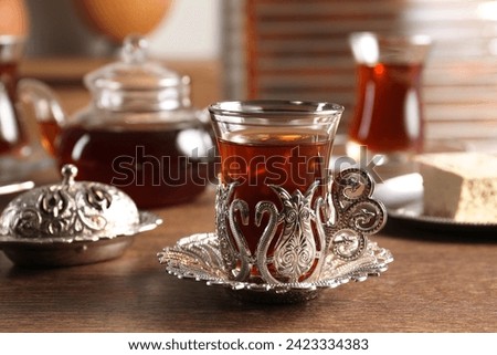Traditional Turkish tea served in vintage tea set on wooden table