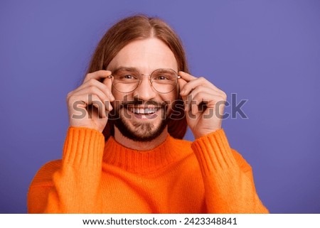 Closeup photo of cheerful satisfied blond hair man bearded programmer touching his new stylish specs isolated on purple color background Royalty-Free Stock Photo #2423348841