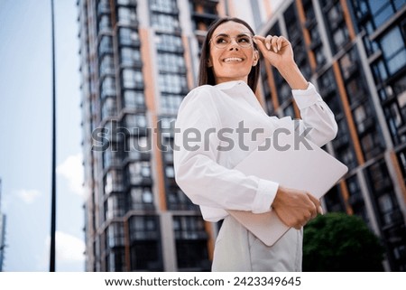 Photo of gorgeous stunning lady professional boss dressed stylish shirt hand hold eyeglasses look modern business center office buildings