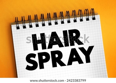 Hair Spray - solution sprayed on to a person's hair to keep it in place, text concept on notepad Royalty-Free Stock Photo #2423383799