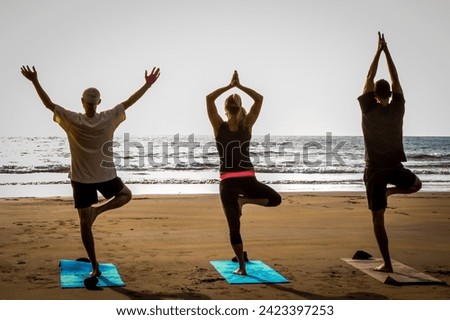 Yoga poses on the beach, Tenerife island
