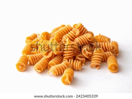 Heap of Organic Italian Chickpea Fusilli Pasta. Gluten-Free, Grain-Free, and Vegan Pasta. Healthy Eating Concept. View from Above.