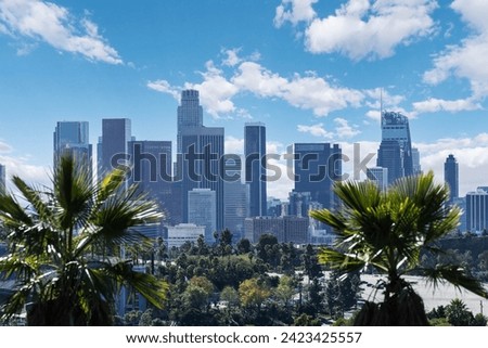 Downtown Los Angeles skyline with palm trees.   Royalty-Free Stock Photo #2423425557