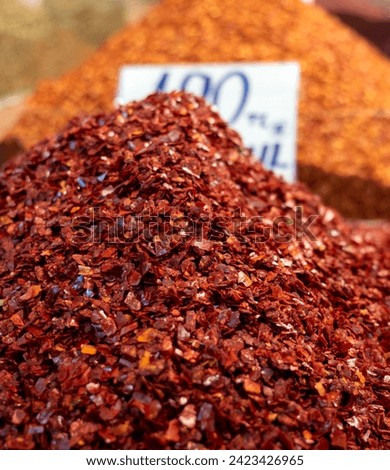 large quantities of large-grained hot red pepper flakes for sale in the market, Royalty-Free Stock Photo #2423426965