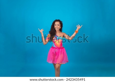 Closeup of beautiful woman dressed for carnival night pointing to the sides free for text or mockup