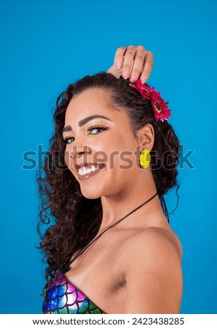 Closeup of beautiful woman with carnival makeup taking a selfie