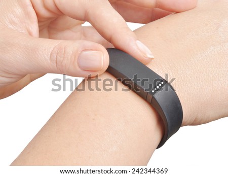 Activity tracker on a woman's wrist Royalty-Free Stock Photo #242344369