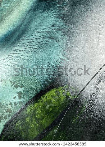 Abstract aqua fluid art texture — abstract turquoise background with coral made with alcohol ink. Blue water texture resembles undersea, sea bottom, aquarium, watercolor or aquarelle.