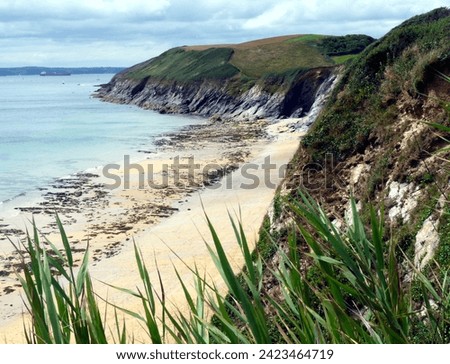 View of cliffs and pristine beach from coastal path, Cornwall, UK. With copy space. High quality photo