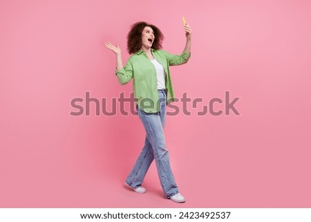 Full body size photo of blogger curly hair woman sending video greetings thanks subscribers for support isolated on pink color background