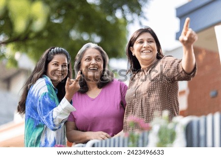 Happy Indian senior women having fun together outdoor 