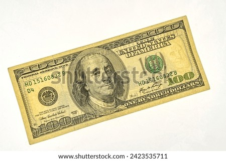 fragment of 100 dollar banknote with visible details of banknote reverse for design purpose. Franklin watermark on 100 bill