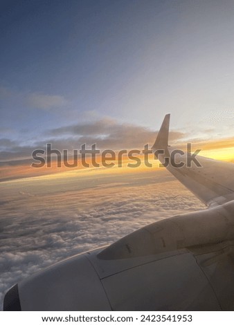 raw picture of sunset from airplane