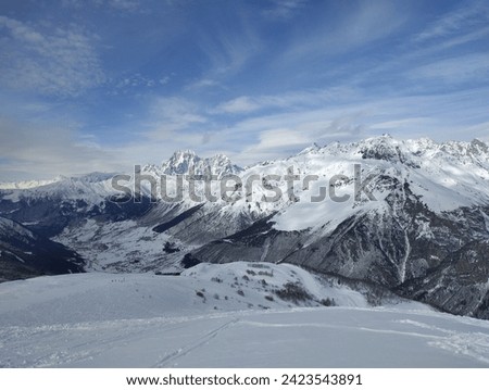 Mountain landscape: Snow-capped mountains during the day in Georgia, Ushba mountain, Svaneti