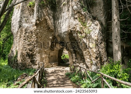 Syracuse, Italy-May 9, 2022:View of the famous and vast natural park in Syracuse with an ancient Greek theatre, a church, caves and other remains from the Roman era. Royalty-Free Stock Photo #2423565093