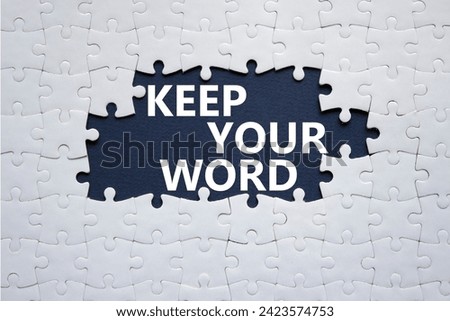 Keep your word symbol. Concept words Keep your word on white puzzle. Beautiful deep blue background. Business and Keep your word concept. Copy space.