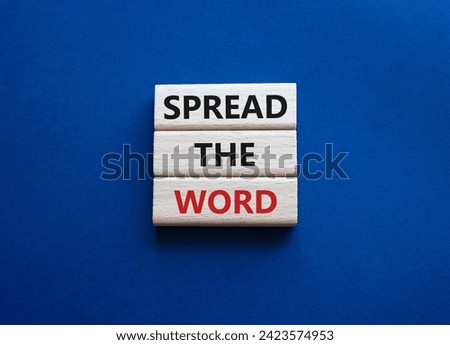 Spread the Word symbol. Concept words Spread the Word on wooden blocks. Beautiful deep blue background. Business and Spread the Word concept. Copy space.