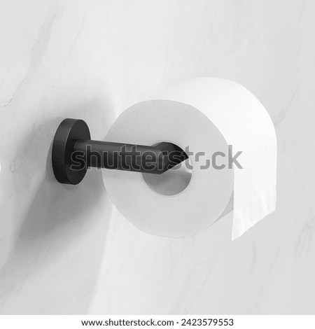 Toilet paper roll on the rack in modern bathroom interior Royalty-Free Stock Photo #2423579553