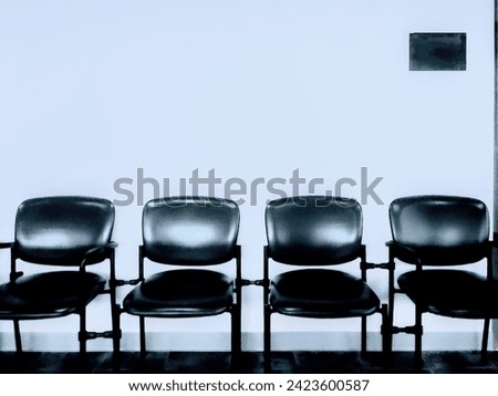 Chairs are lined up in a medical plaza's waiting room.