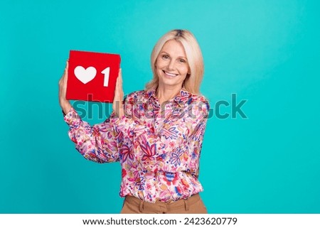 Photo of cheerful excited lady wear print blouse rising notification sign isolated teal color background