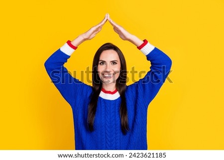 Portrait photo of mature age woman make arms roof gesture above head decided to create her own house isolated on yellow color background