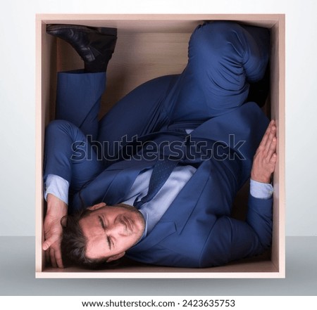 Employee working in tight space Royalty-Free Stock Photo #2423635753