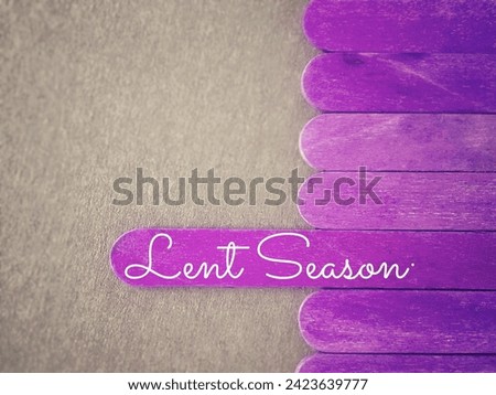 Lent Season,Holy Week and Good Friday Concepts. Lent Season text on wooden stick in purple colour background. Stock photo.