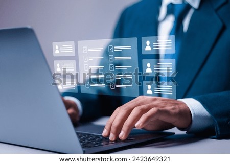 Human resource management (HR) concept, Businessman use laptop filling out online employee appraisal form. recruiting, leadership and team building. Royalty-Free Stock Photo #2423649321