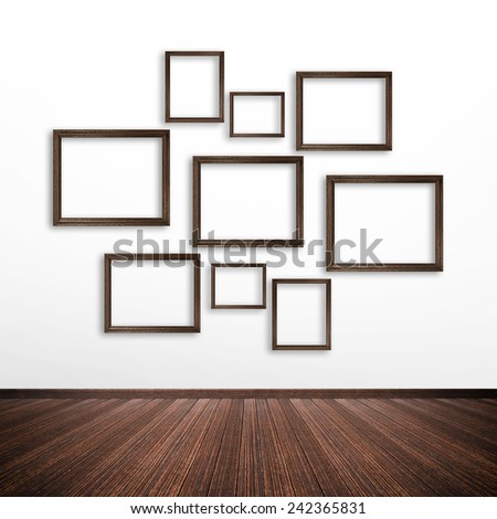 Wooden picture frames on white wall inside the room