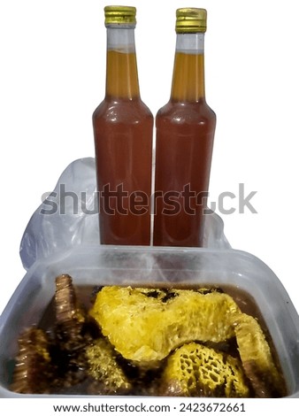 honey packaged in a bottle, with the honey in the nest, isolated on white background