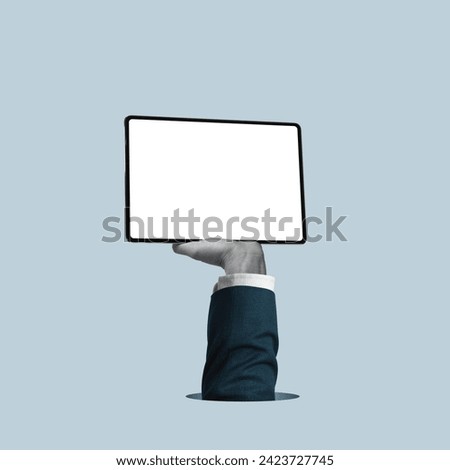 The hand holds a tablet with a white screen. Art collage. Mockup.