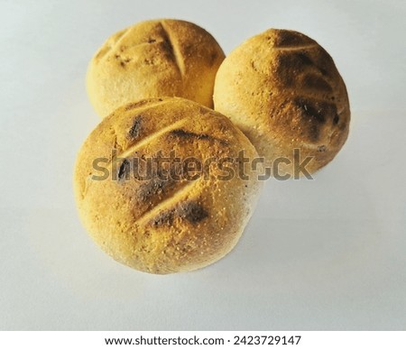 Indian food Baati or Litti three in number made of wheat flour in white background.