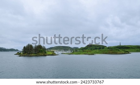 Boats and pleasure yachts moored at Inner Hebrides islands, view from the water, Scotland, United Kingdom Royalty-Free Stock Photo #2423733767