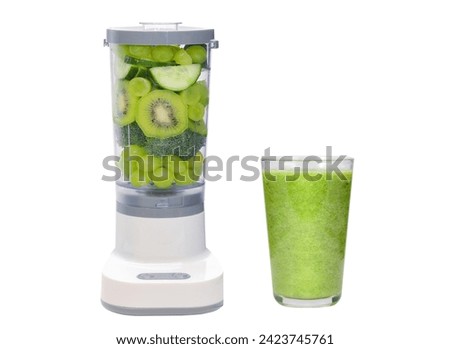 Green shake drink concept , mixed fruit and vegetable in blender preparing for making green smoothie with a glass of green smoothie after blend for detox dietary, isolated clipping path on white.  Royalty-Free Stock Photo #2423745761