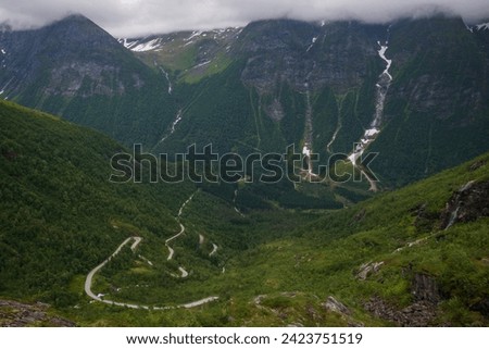 The scenic route of Gaularfjellet where the road twists and turns through nine hairpin bends, offeing jaw-dropping scenery. The stop at Utsikten allows travelers to view the scenery.  Royalty-Free Stock Photo #2423751519