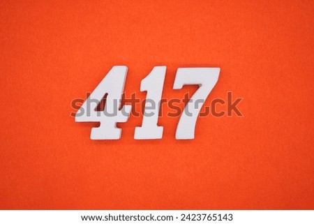 Orange felt is the background. The numbers 417 are made from white painted wood.