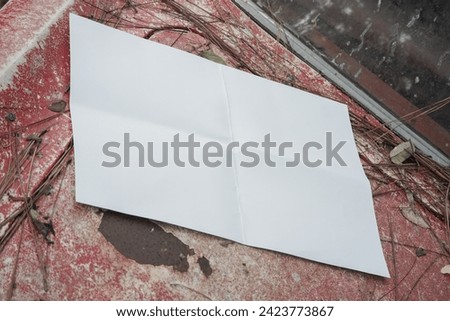 white blank poster for mockup on a damaged car in an abandoned forest, red background, landscape wallpaper 4