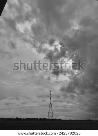 Electrical tower and cloudy cloud monocrome picture
