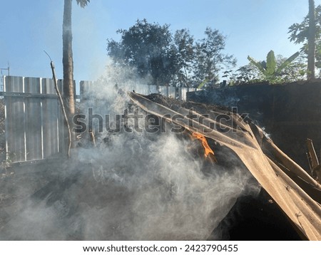 Bonfire and zinc with smoke rising