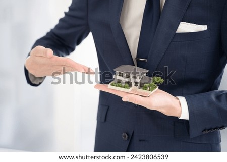 Businessman recommending condominium real estate