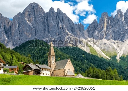 Iconic small chapel Santa Maddalena in front of the Geislergruppe mountains at Villnöß in South Tyrol, Italy Royalty-Free Stock Photo #2423820051
