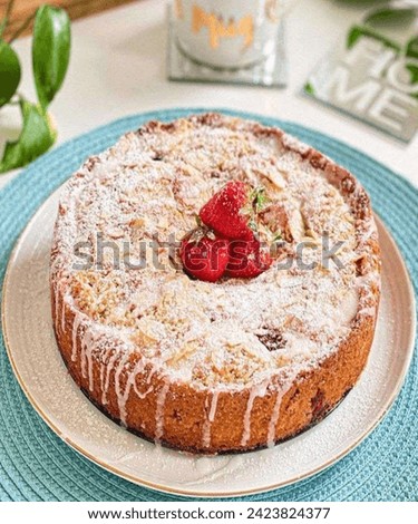 Very delicious homemade eggless strawberry cake filled with grated coconut.jpeg