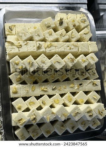 The image is of a tray of cheese, categorized under tags like snack, food, dairy, dessert, and indoor.
